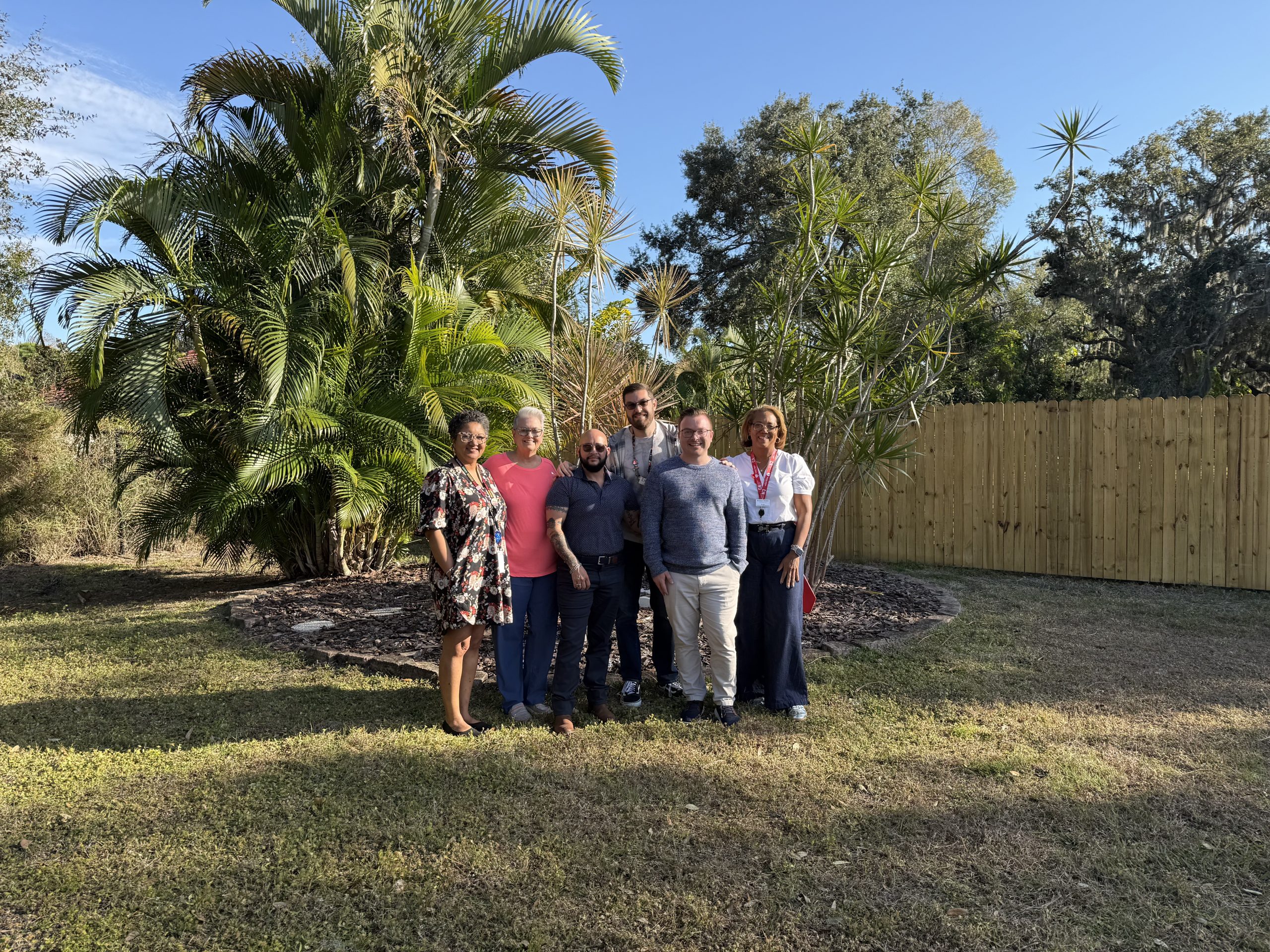AIDS Memorial Committee members gathered outdoors at Church of the Trinity MCC.