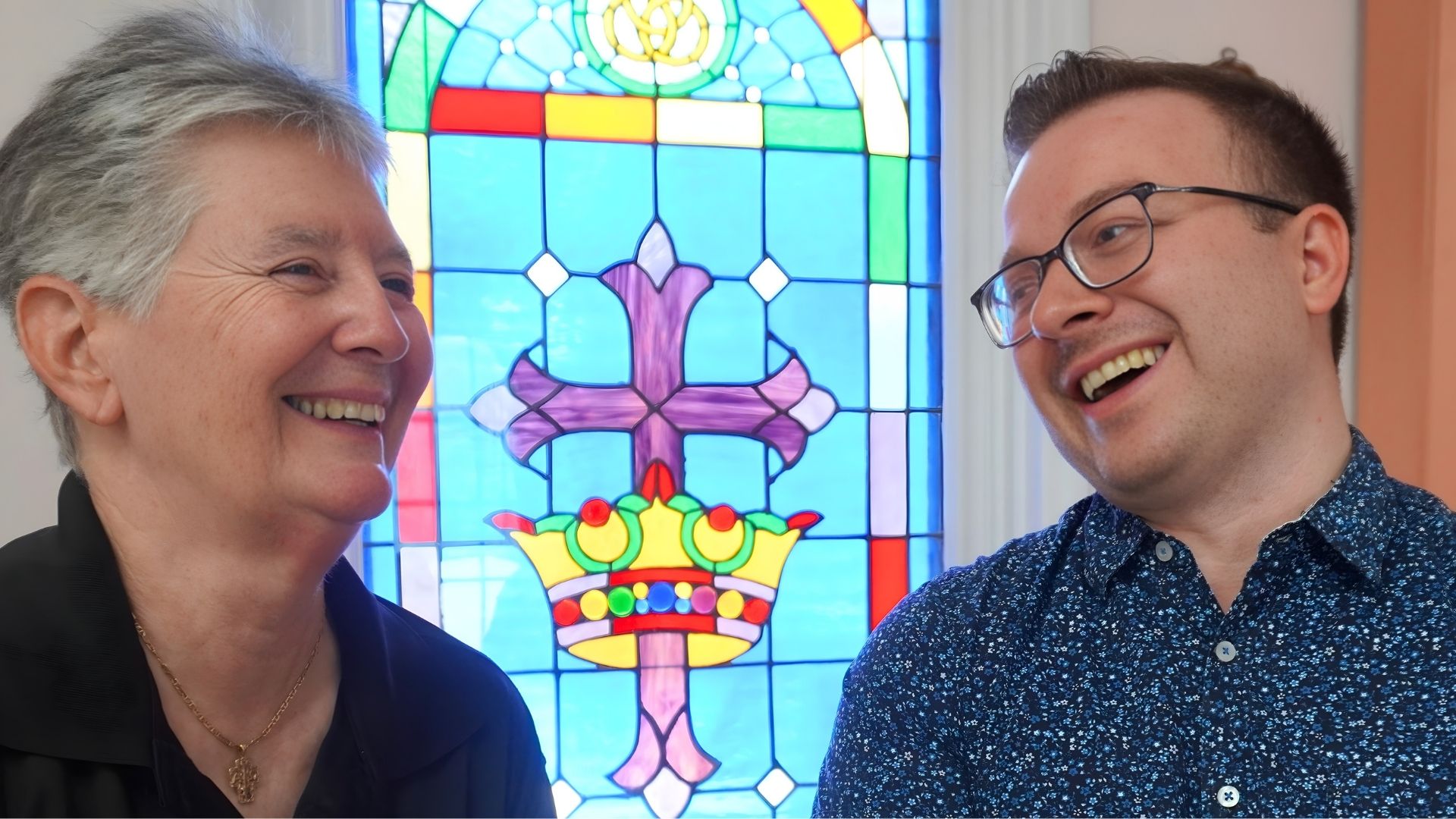 JT Priar and Jesse Clayton smiling together inside Church of the Trinity MCC.