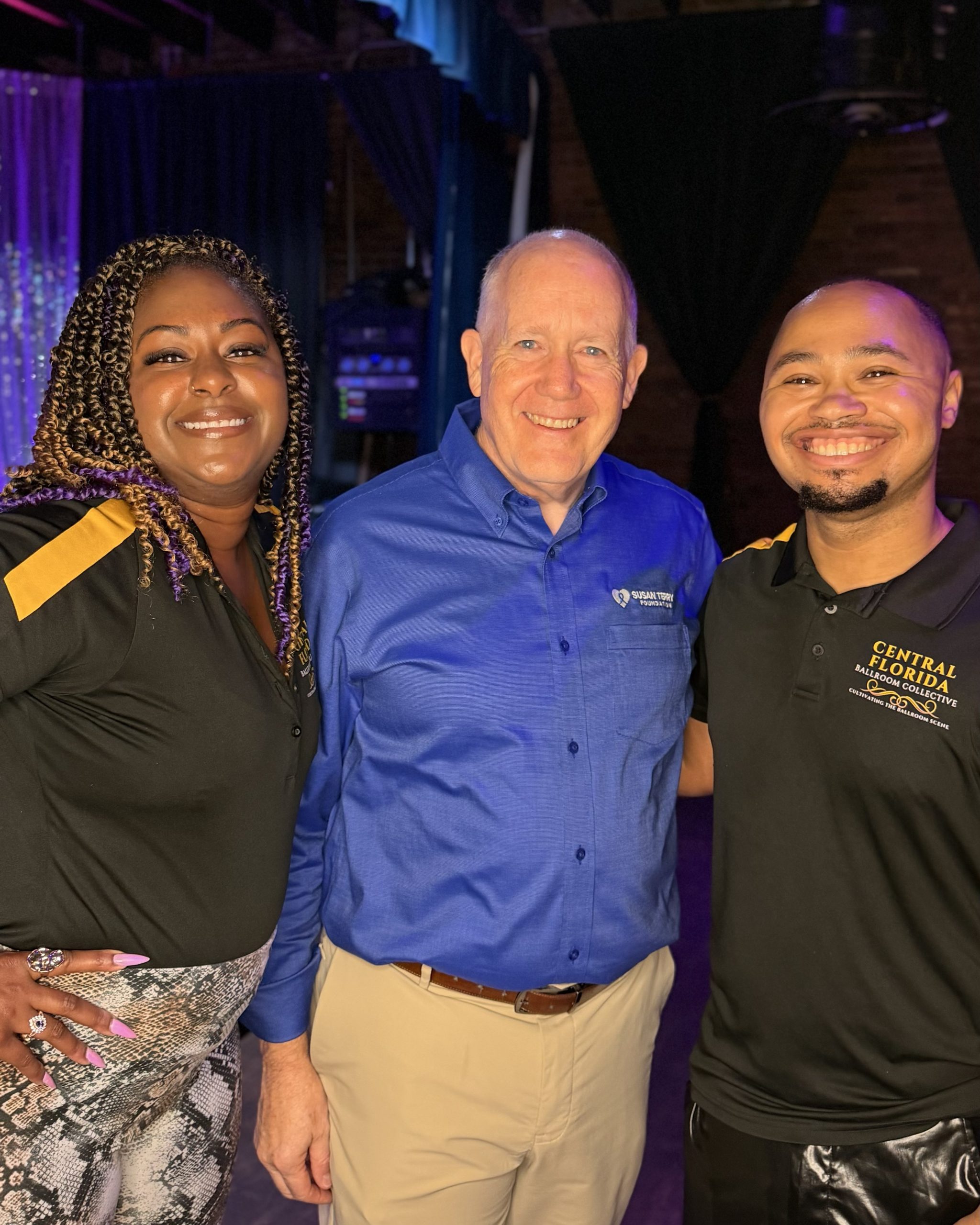 Central Florida Ballroom Collective and Susan Terry Foundation representatives standing together during a check presentation.