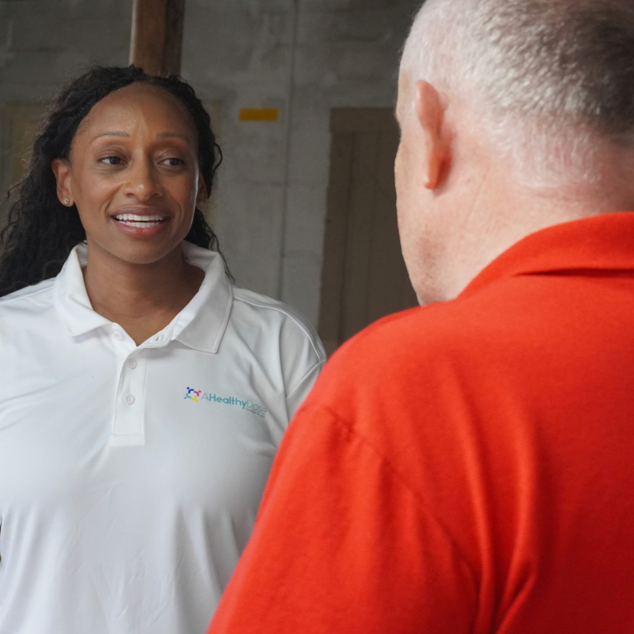 Dr. Brittney Roy speaking with a Susan Terry Foundation representative.